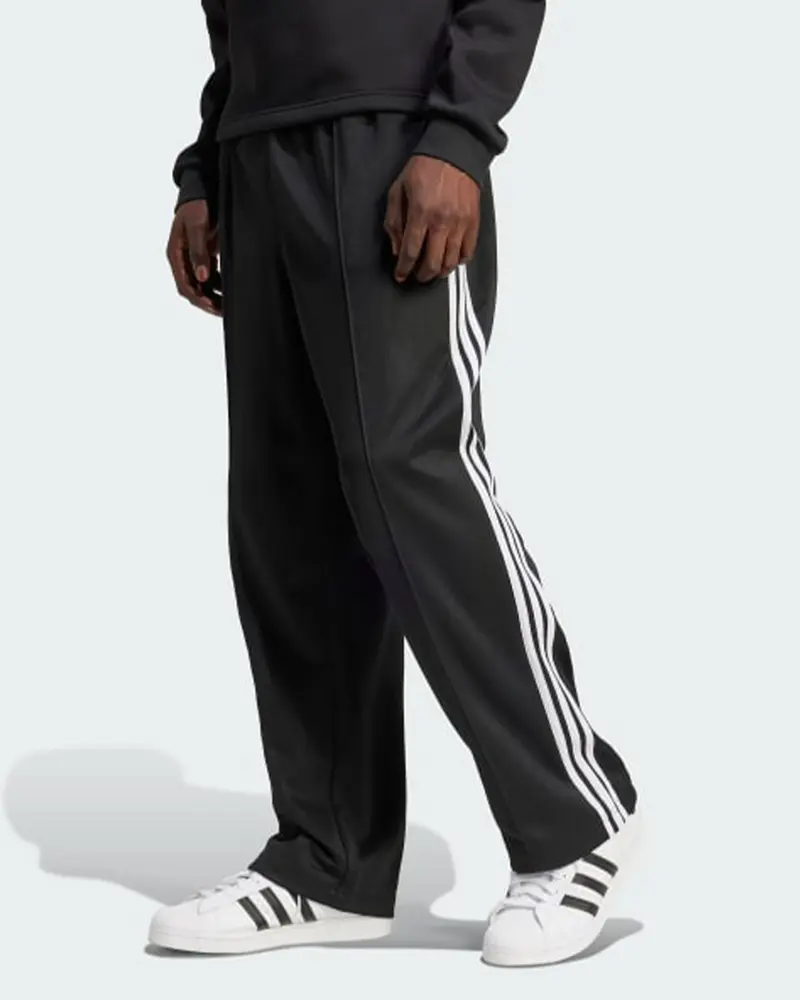 ADIDAS ORIGINALS PANTALONE DI TUTA BAGGY CON LOGO UOMO IZ4801