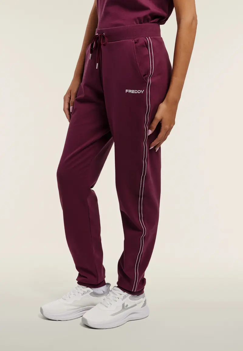 Jogger donna con bande perlate e fondo a polsino