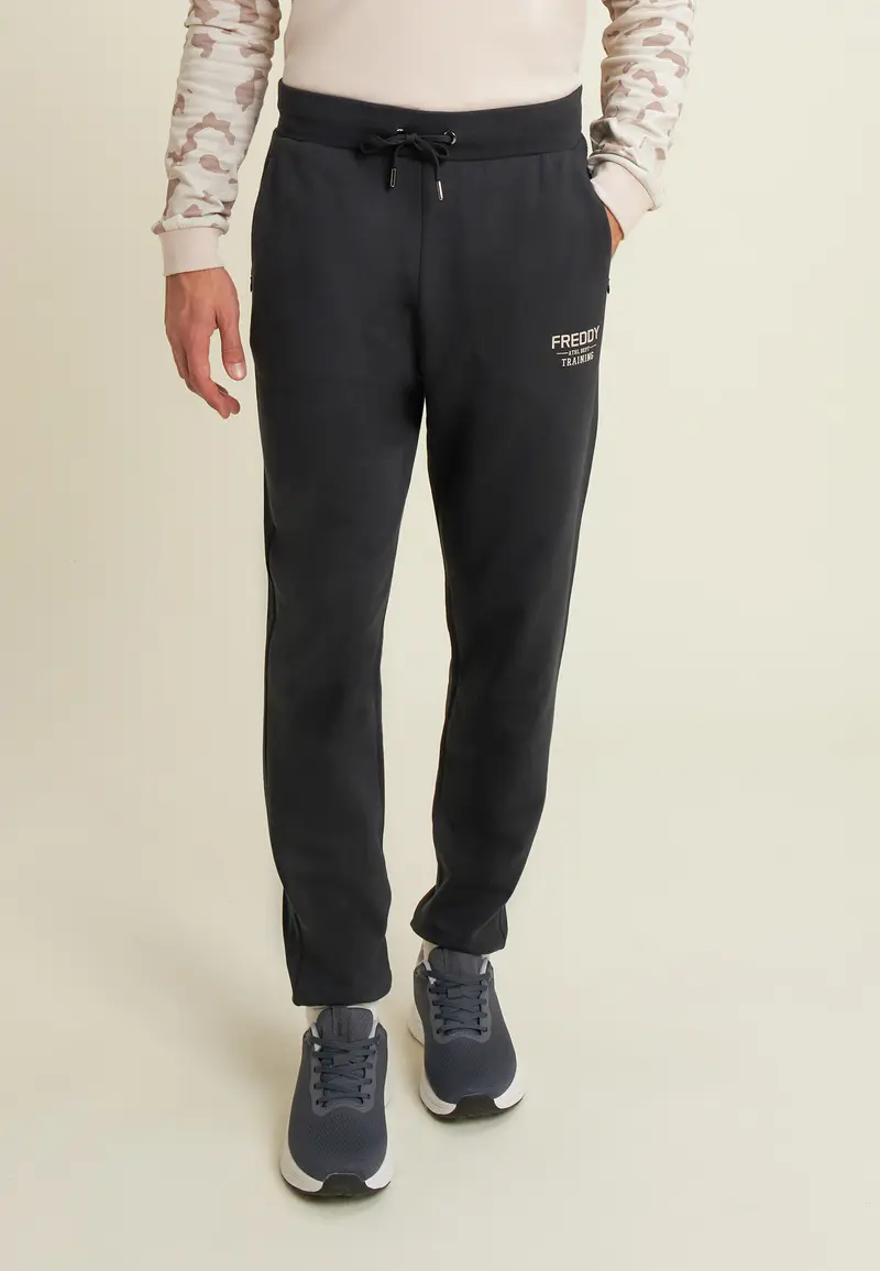 Pantaloni in felpa con fondo a polsino e dettagli rigati