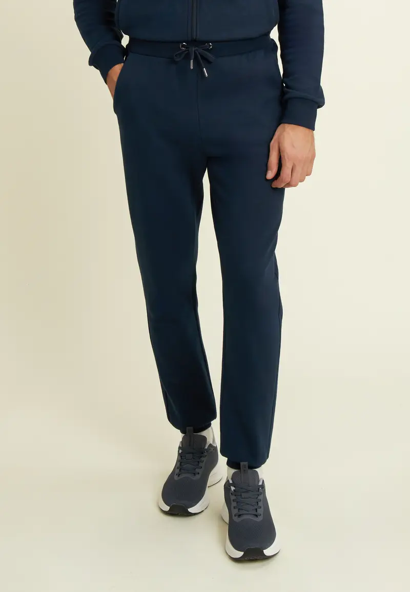 Pantaloni regular in felpa garzata con fondo in costina
