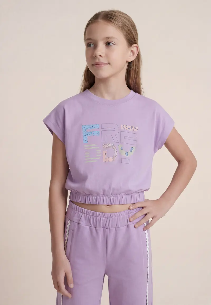 T-shirt cropped senza maniche con logo fantasia